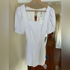 white romper with back cut out and puff sleeves brand new unworn
